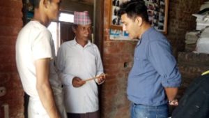 Om Krishna Shrestha General Secretary of SWAN in the blue shirt.