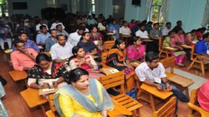 Attendees sitting at desks