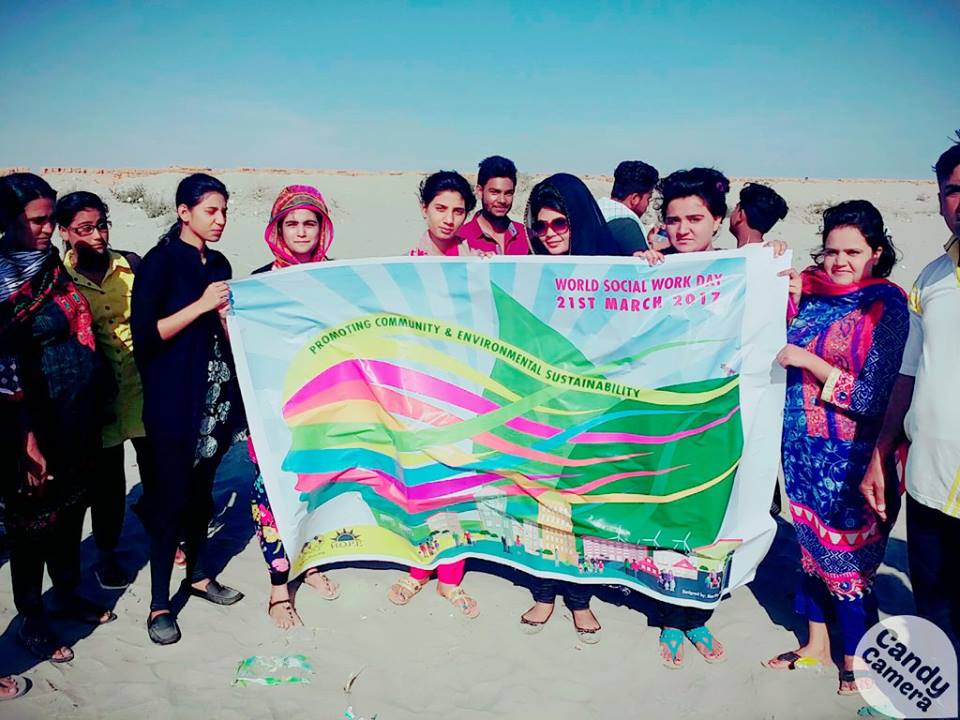 Pakistani social workers holding a poster for World Social Work Day 2017