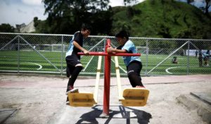 Children play on swings